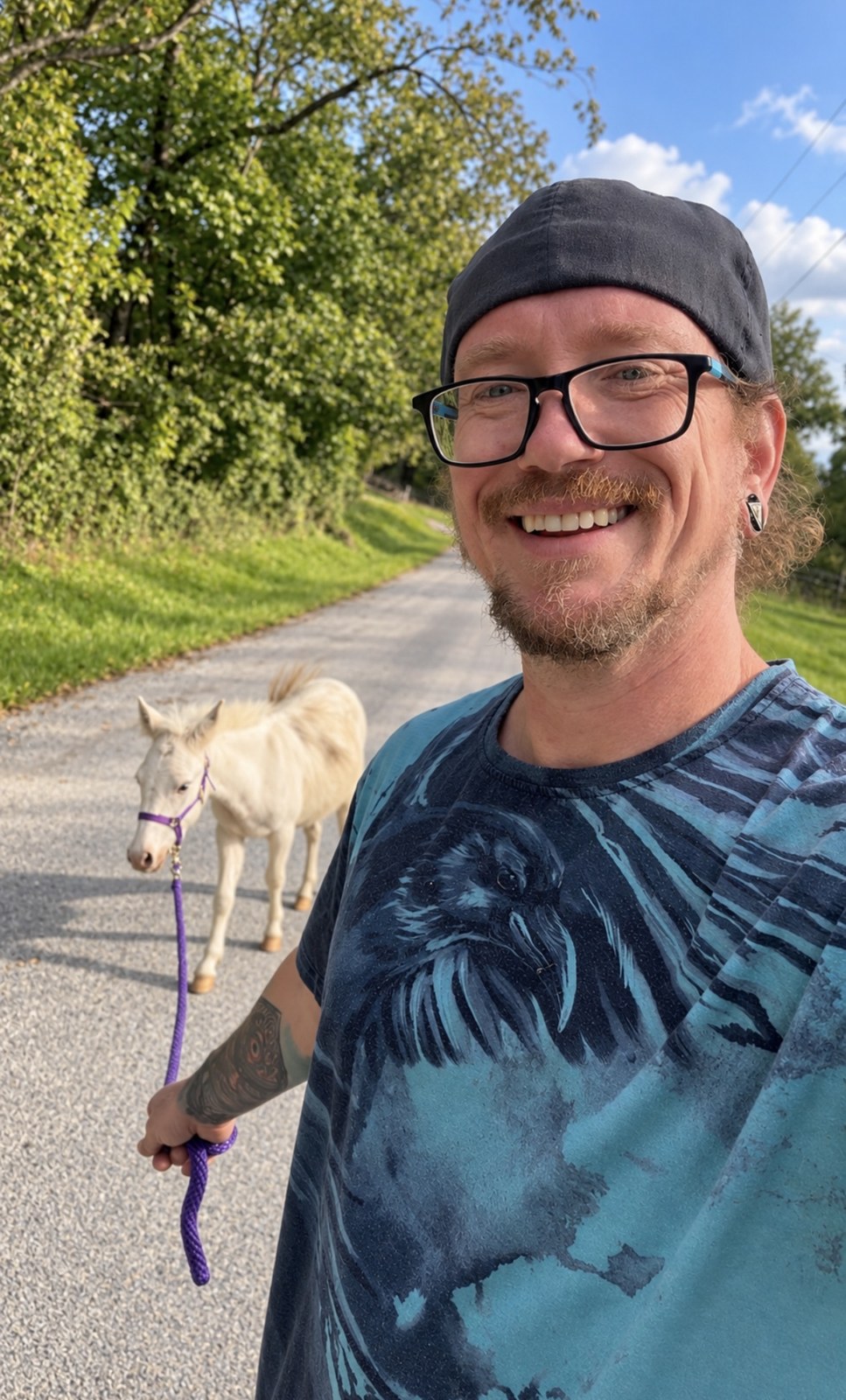 Michael H. Schricker with LeeLoo the rescue mini mule on the road at Bigfoot's Farm, Bloomingdale, Ohio
